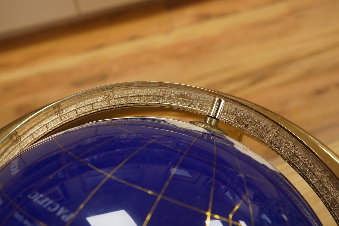 A simulated multi-mineral globe with compass, 30cm in diameter